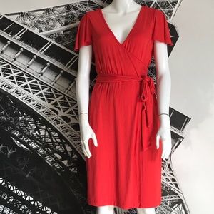 Red Calvin Klein dress with cape sleeves